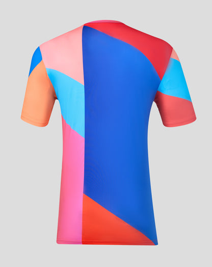 Colorful geometric-patterned shirt on a gray background