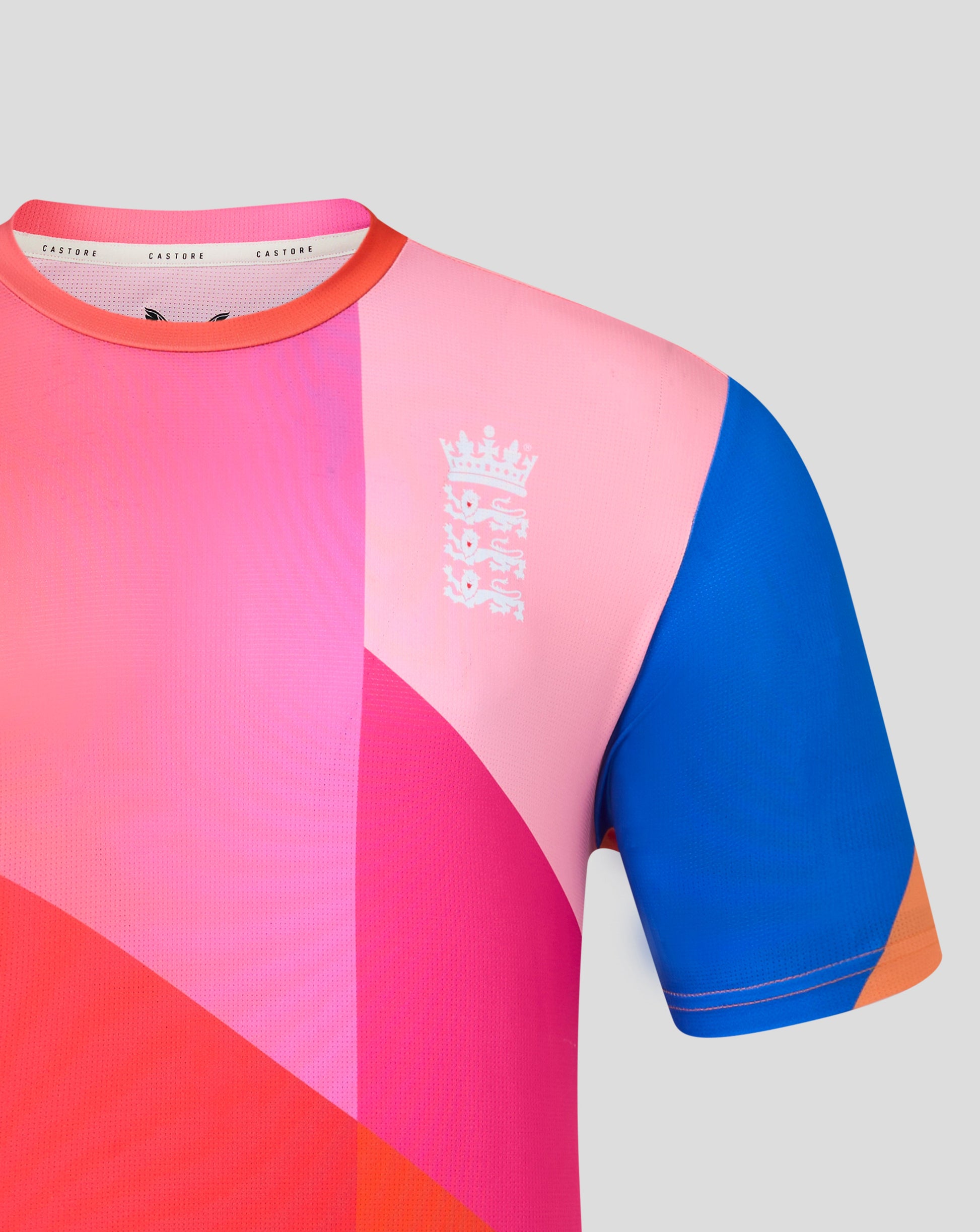 Colorful athletic shirt with geometric design on a light gray background