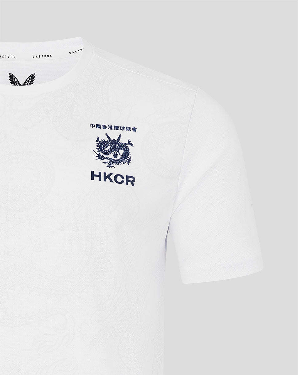 White t-shirt with black logos and text on a light gray background