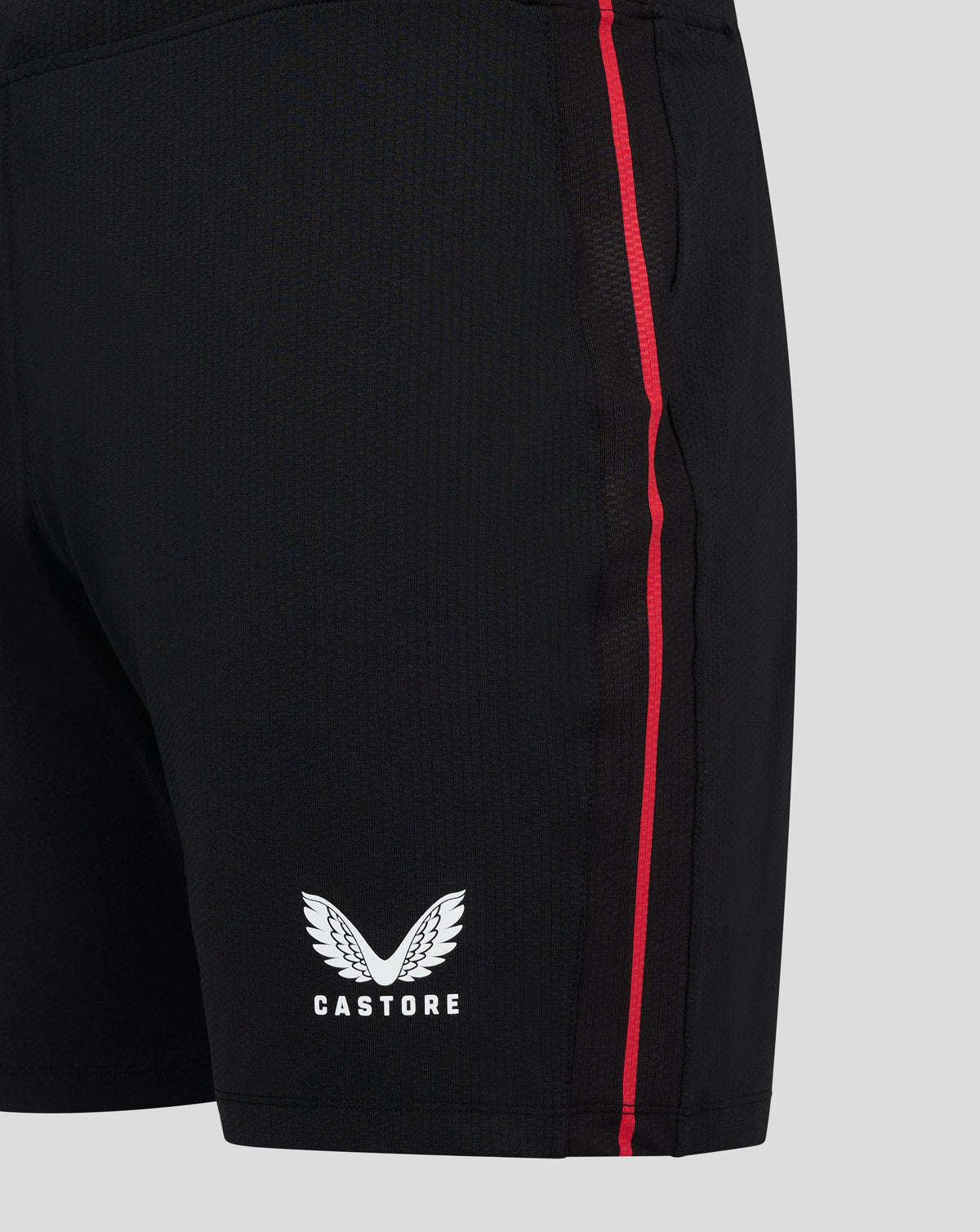 Close up of black Bayer Leverkusen Pro shorts with a red side stripe and Castore crest