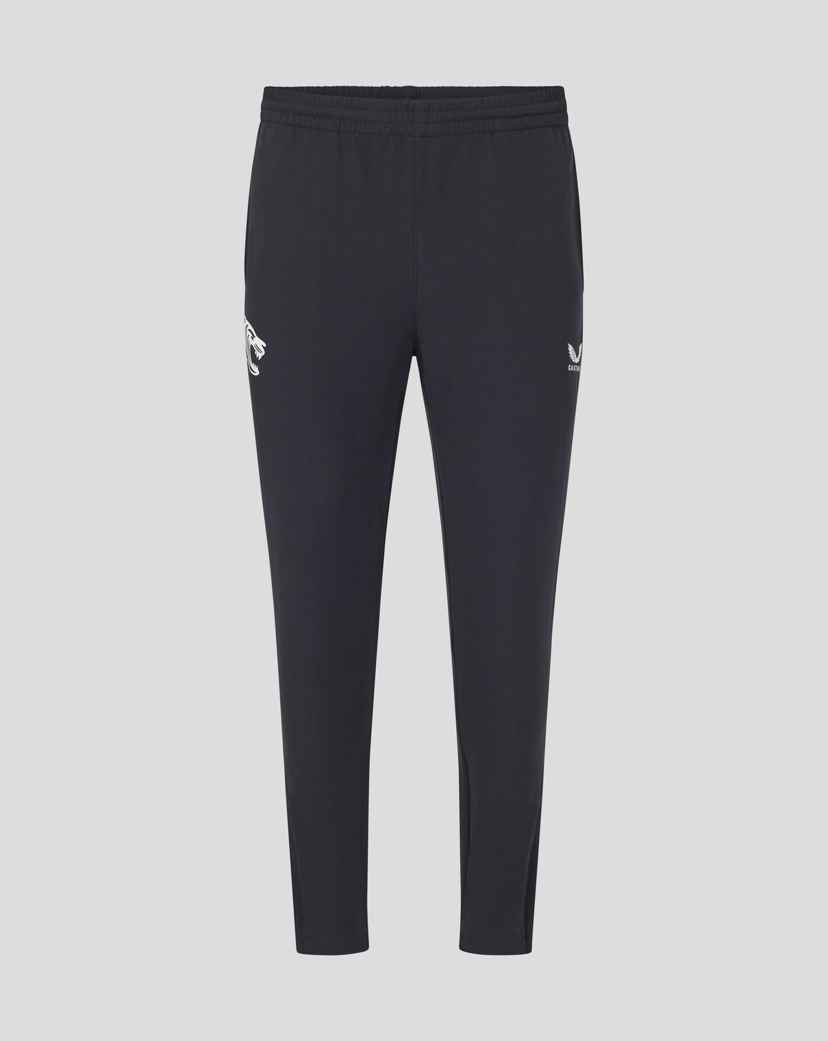 Front view of dark navy training track pants with a white tiger logo on the left thigh