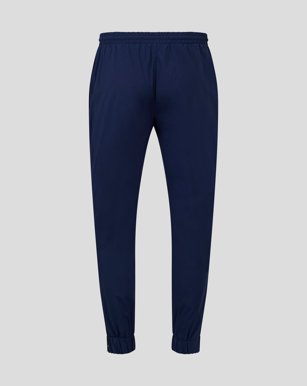 Back view of navy rugby pant with elasticated waistband and cuffs and mesh lining