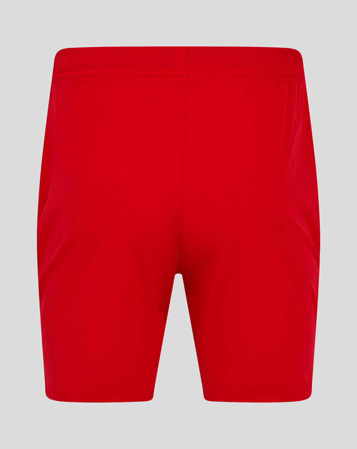 Back view of bright red mens woven training shorts with an elastic waistband and central seam.