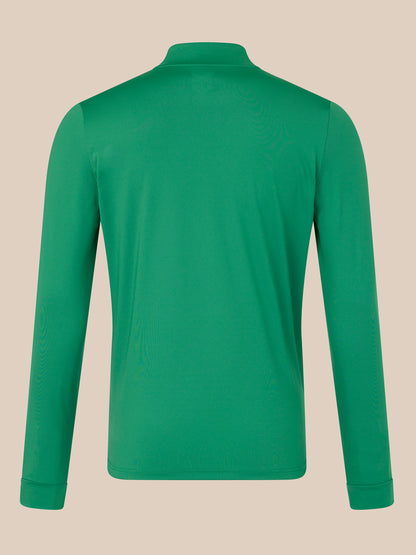 Green long-sleeve shirt on a beige background