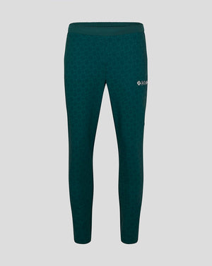 Green men's Athletic Club travel pants with a subtle jacquard pattern and a logo on the right thigh.