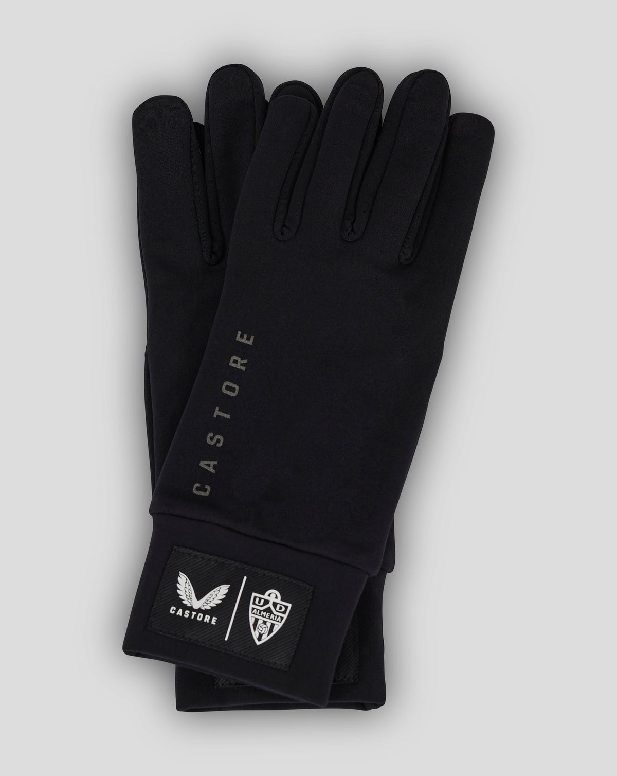 Almeria Club black gloves showing a patch with club crest and Castore branding