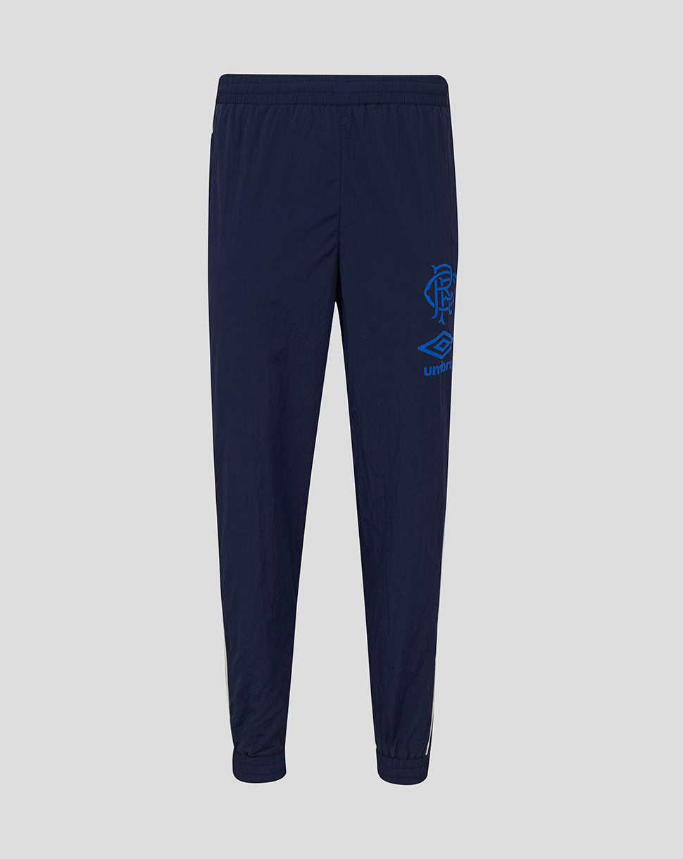 Navy Rangers travel pants with elastic waistband and ribbed cuffs, featuring the club crest and reflective logo on the leg.