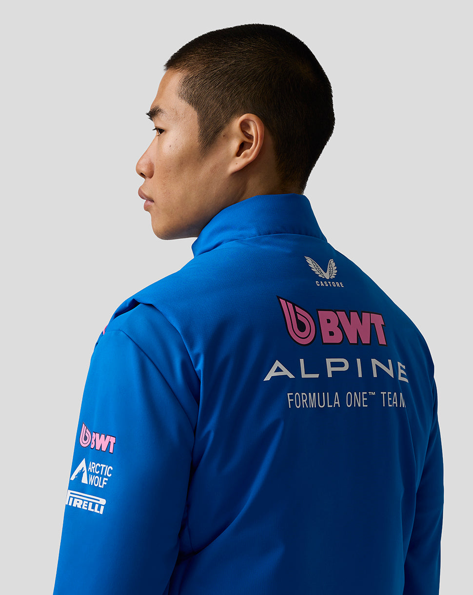 Back view of blue BWT Alpine gilet showing prominent logos on the back from a different angle