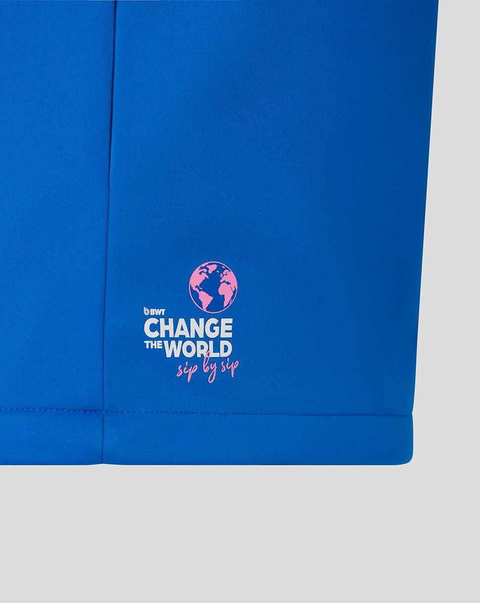 Blue BWT Alpine soft shell jacket hem with pink globe logo and Change the World sip by sip text
