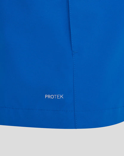 Close-up of a blue jacket with 'PROTEK' branding on a white background