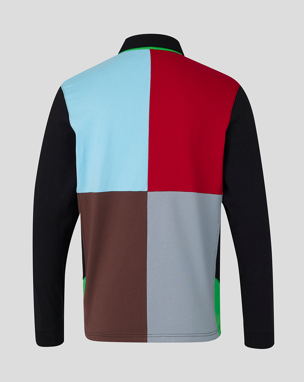 Color-blocked jacket with black, blue, red, brown, gray, and green sections on a light gray background