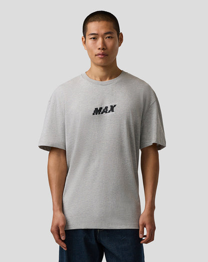 Man wearing a gray t-shirt with 'MAX' print on a plain background