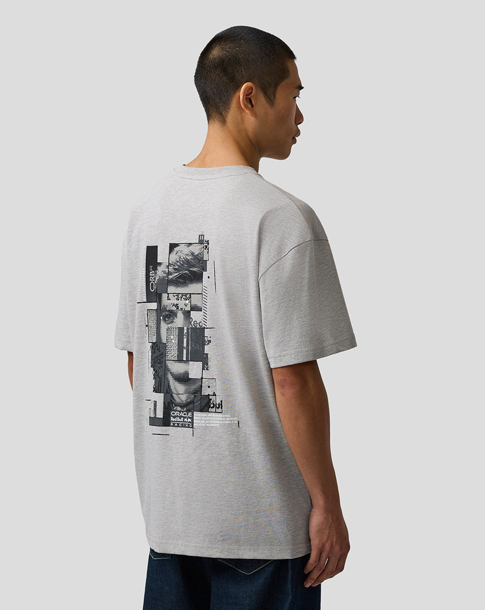 Person wearing a gray t-shirt with a graphic design on the back against a plain background