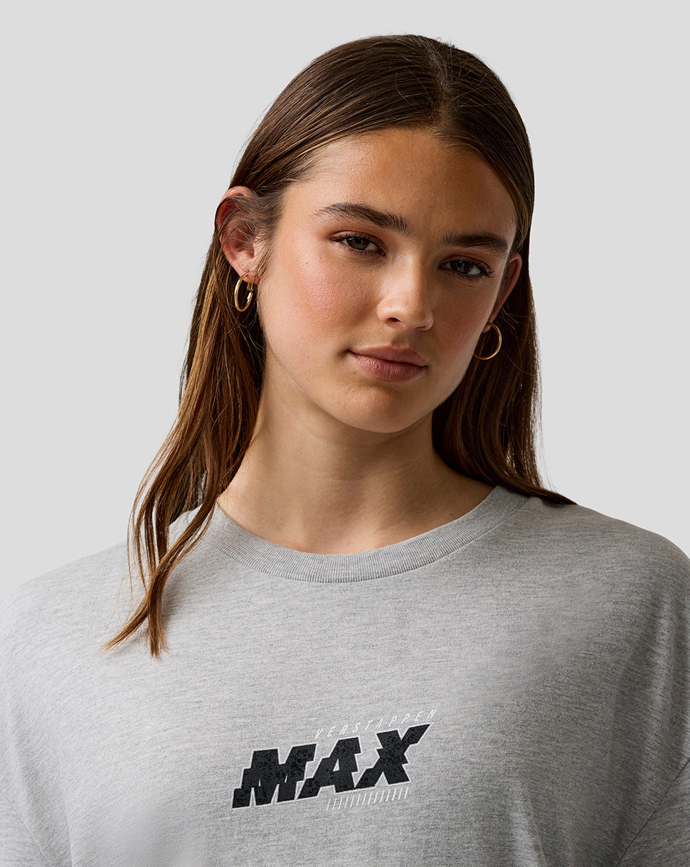 Person wearing a gray sweatshirt with 'MAX' logo on a plain background