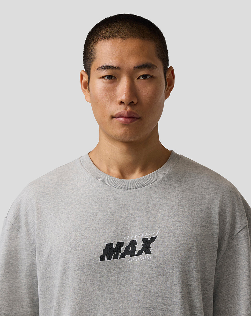 Man wearing a gray sweatshirt with 'MAX' logo on a plain background