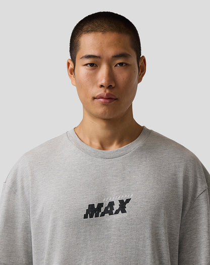 Man wearing a gray sweatshirt with 'MAX' logo on a plain background
