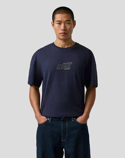 Man wearing a navy blue t-shirt with a logo on a light gray background