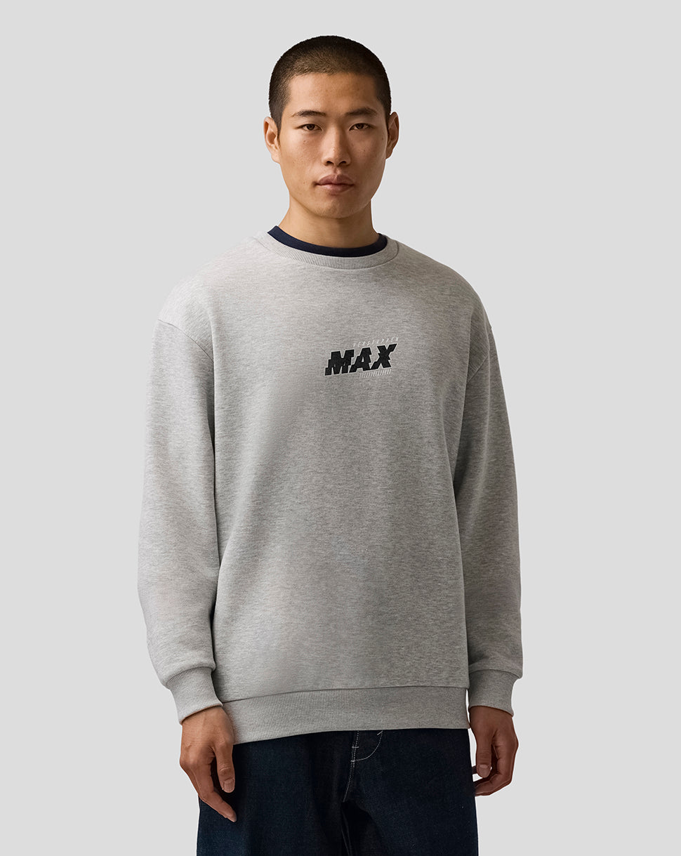 Man wearing a gray sweatshirt with 'MAX' text on a plain background