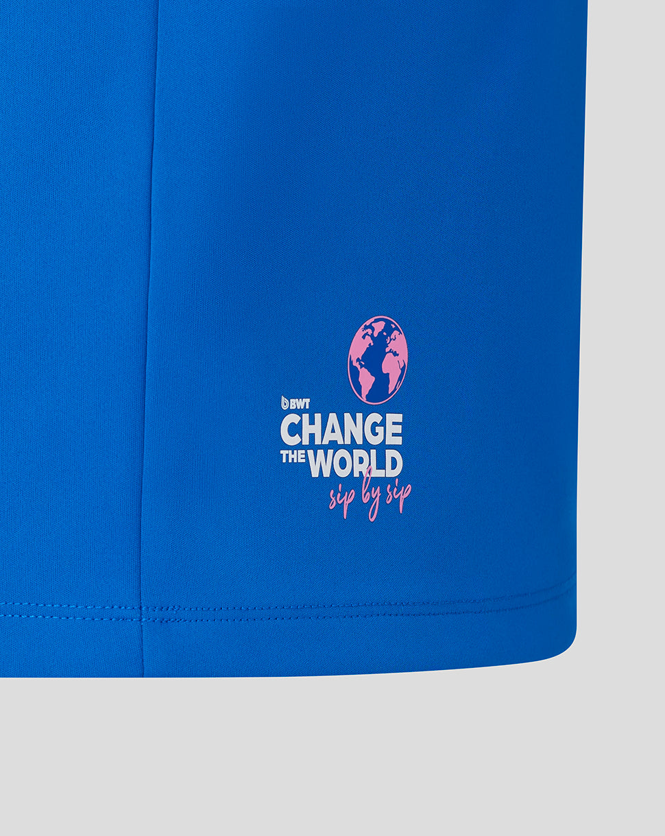 Blue BWT Alpine midlayer with pink Change the World sip by sip logo on the front lower hem.