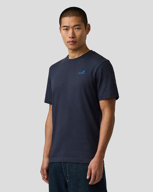 Male model wearing a navy Unisex Core Regular Fit Shirt with a small blue logo on the chest.