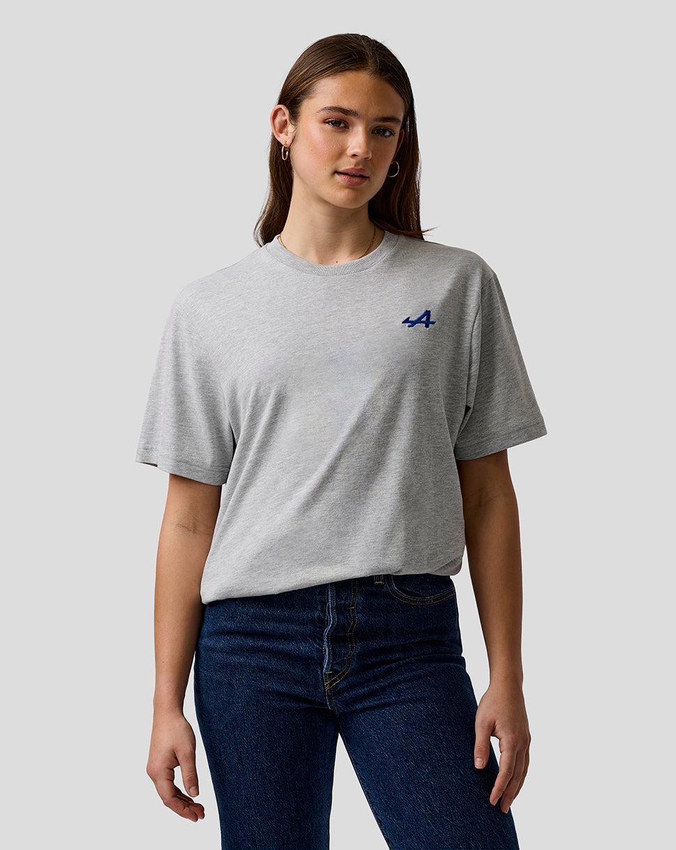 Female model wearing a grey marl unisex T shirt with a small blue embroidered A logo on the left chest
