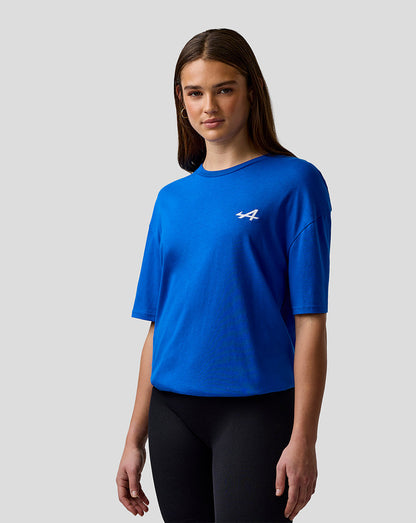Woman modeling lapis blue unisex relaxed fit short sleeve T shirt with A logo on the chest