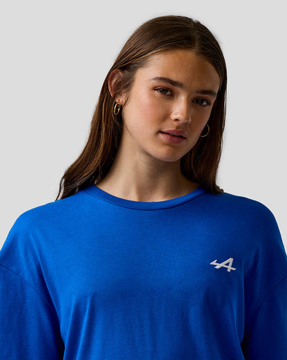 Close up of a female model wearing lapis blue unisex relaxed fit T shirt with embroidered A logo on the left chest