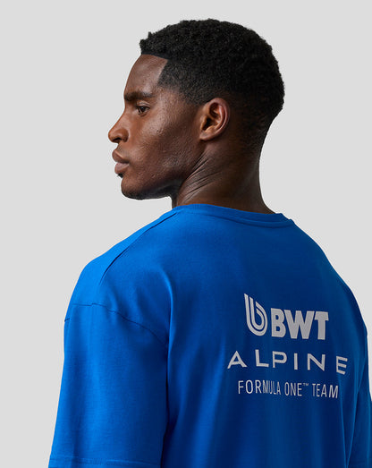 Model wearing lapis blue relaxed fit short sleeve T-shirt with large logo on the back.