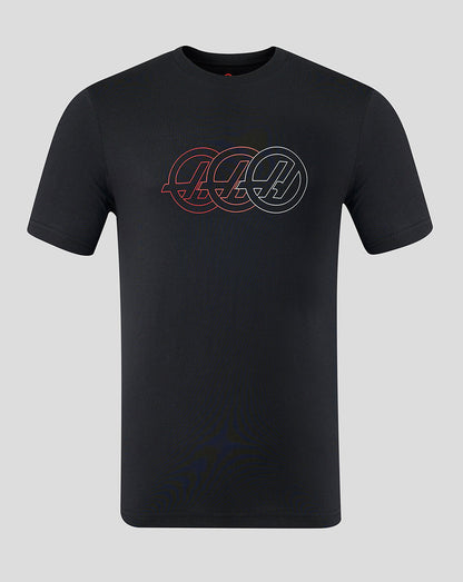 Black t-shirt with a logo on a gray background