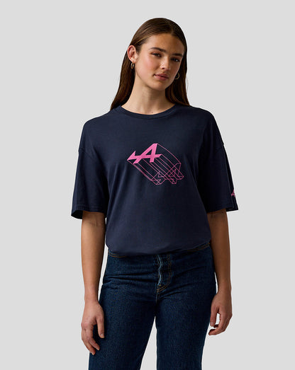 Female model wearing navy relaxed fit graphic T shirt with pink Alpine A print on the chest