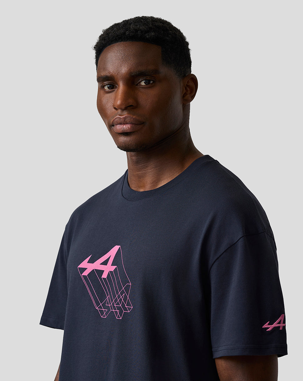 Male model wearing navy relaxed fit graphic T shirt with pink Alpine geometric chest print and a logo on the left sleeve.