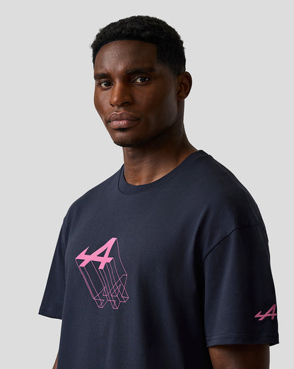 Male model wearing navy relaxed fit graphic T shirt with pink Alpine geometric chest print and a logo on the left sleeve.