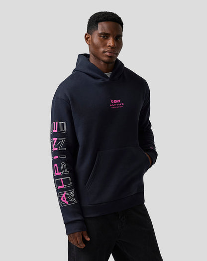 Man wearing navy Night Sky hoodie with pink Alpine chest logo.