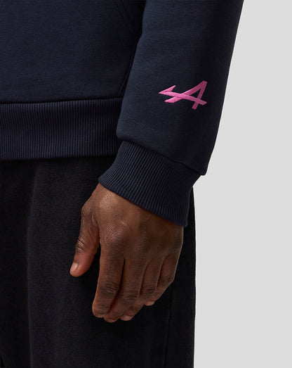 Dark navy hoodie sleeve with pink embroidered A logo near the cuff.