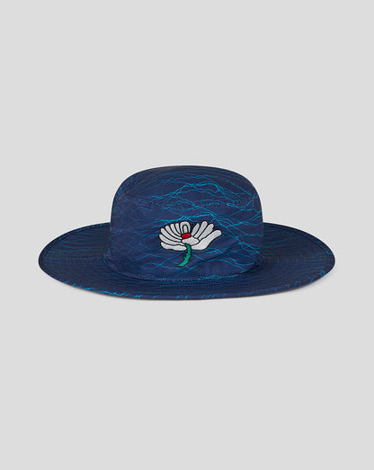 Blue woven hat with a floral design on a light gray background