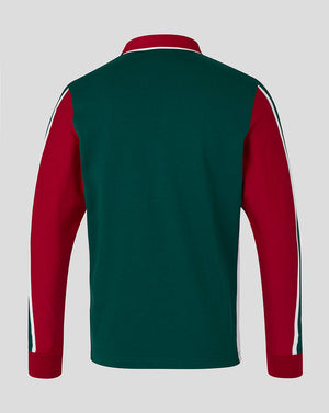 Green and red sports top with white stripes on a gray background