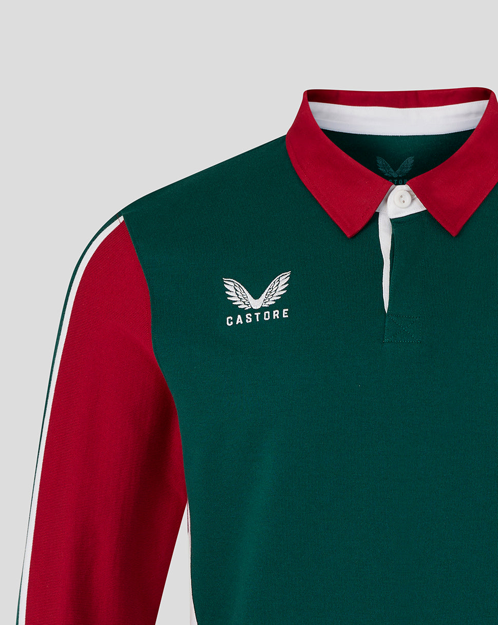 Green and red sports jersey with 'Castore' logo on a light gray background