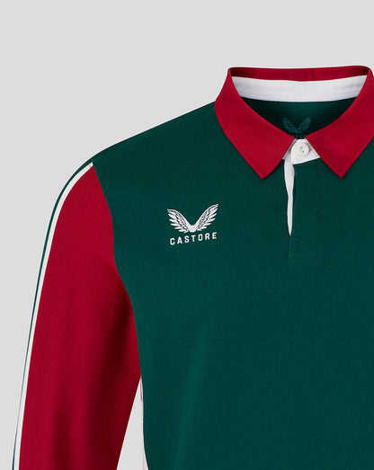 Green and red sports jersey with 'Castore' logo on a light gray background
