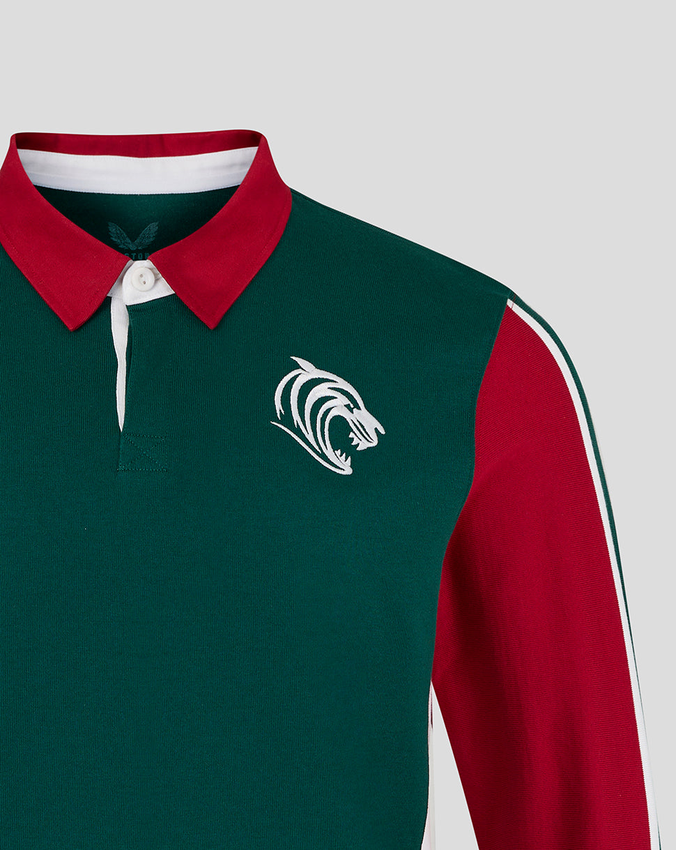 Green and red sports jersey with a logo on a light gray background