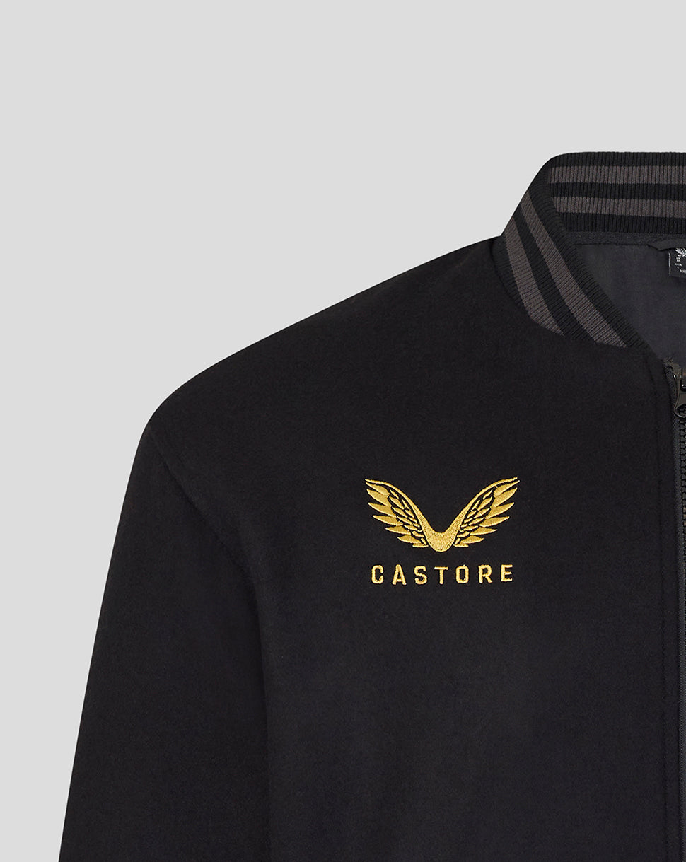 Black jacket with gold logo and 'CASTORE' text on a light gray background