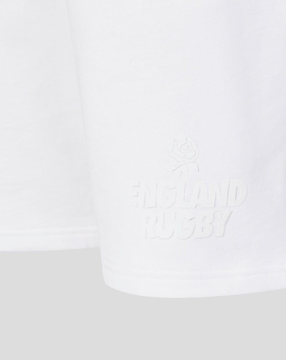 White t-shirt with text on a light gray background