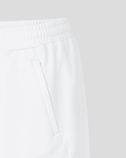 Close-up of white pants with a plain background