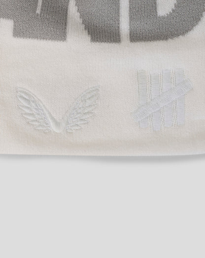 Close-up of a logo with wings on a white background