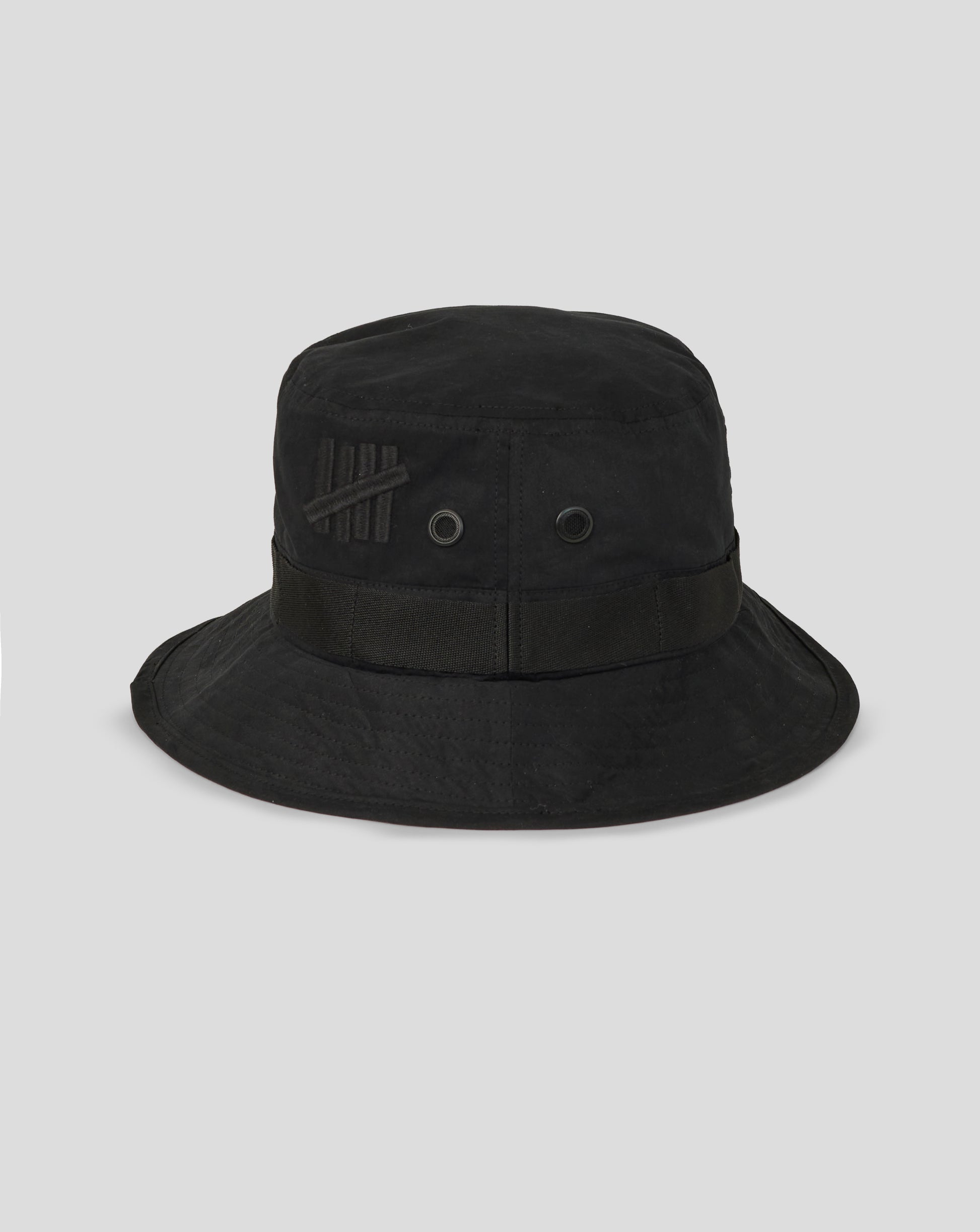 Black bucket hat with a brand logo on a light gray background