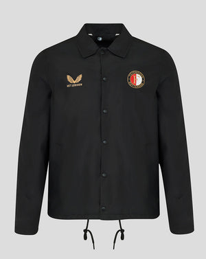 A black long-sleeve button-up jacket with a collar, featuring a gold embroidered winged logo and 'HET LAKEN' text on the right chest, and a circular red, white, and gold crest on the left chest. The jacket is displayed on a neutral light gray background.