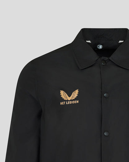 A close-up of a black collared button-up shirt with a gold embroidered winged logo and the text 'HET LEGIOEN' on the left chest, shown against a light gray background.