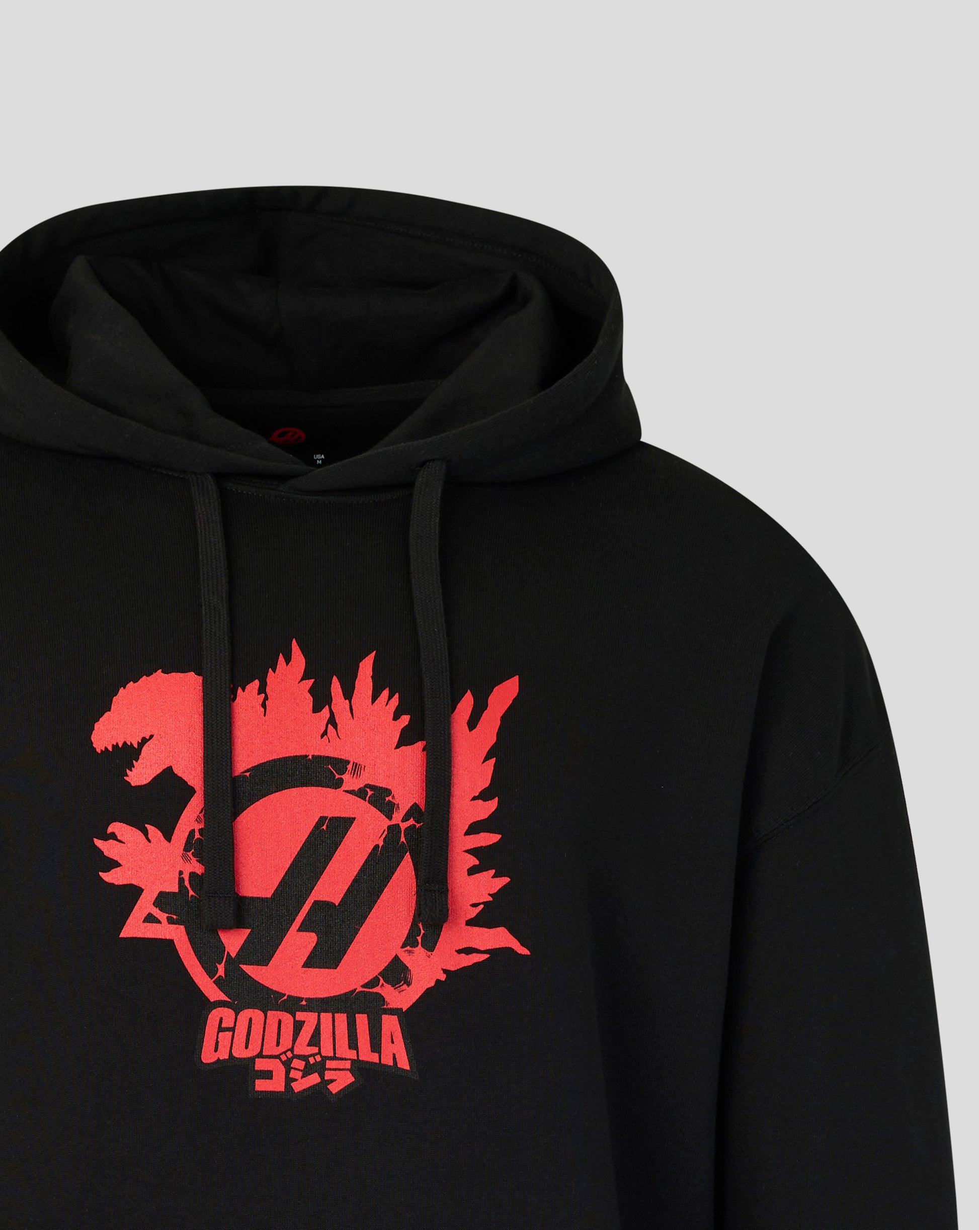 Black hoodie with red 'GODZILLA' logo on a gray background