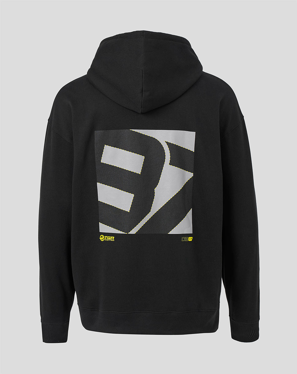 Black pullover hoodie shown from the back, featuring a large square graphic print with a stylized white and gray letterform and small yellow accents near the bottom of the graphic, on a light gray background.
