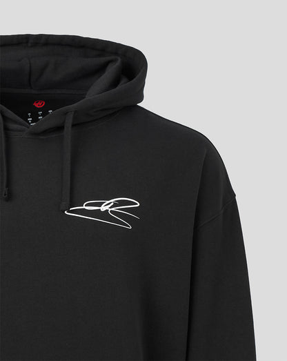 Close-up of a black pullover hoodie with a white abstract line graphic on the left chest, shown against a light gray background.