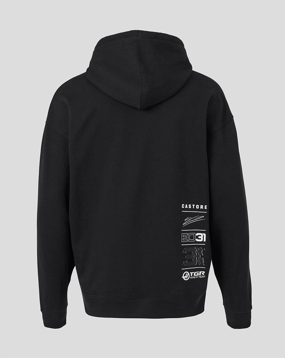 Black pullover hoodie shown from the back, featuring white graphic text and logo prints on the lower back, set against a solid light gray background.